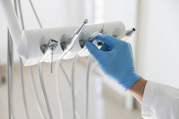Professional Tooth Extraction technician working in East Milton, FL